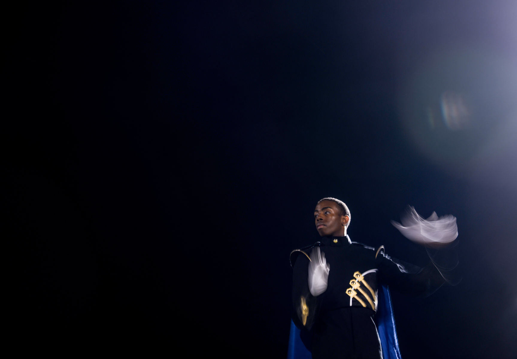 Rhondell Tipton conducts during the half time
